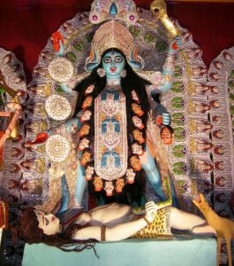 A goddess and her lover (from the Kali Puja festival in Calcutta). " ... had me dragged out of the house and essentially beaten until I realized that she was real and I was not dreaming." (Source: Wikimedia.)